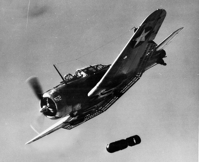 An SBD making a bombing run. Note the extended “Swiss cheese” dive flaps.